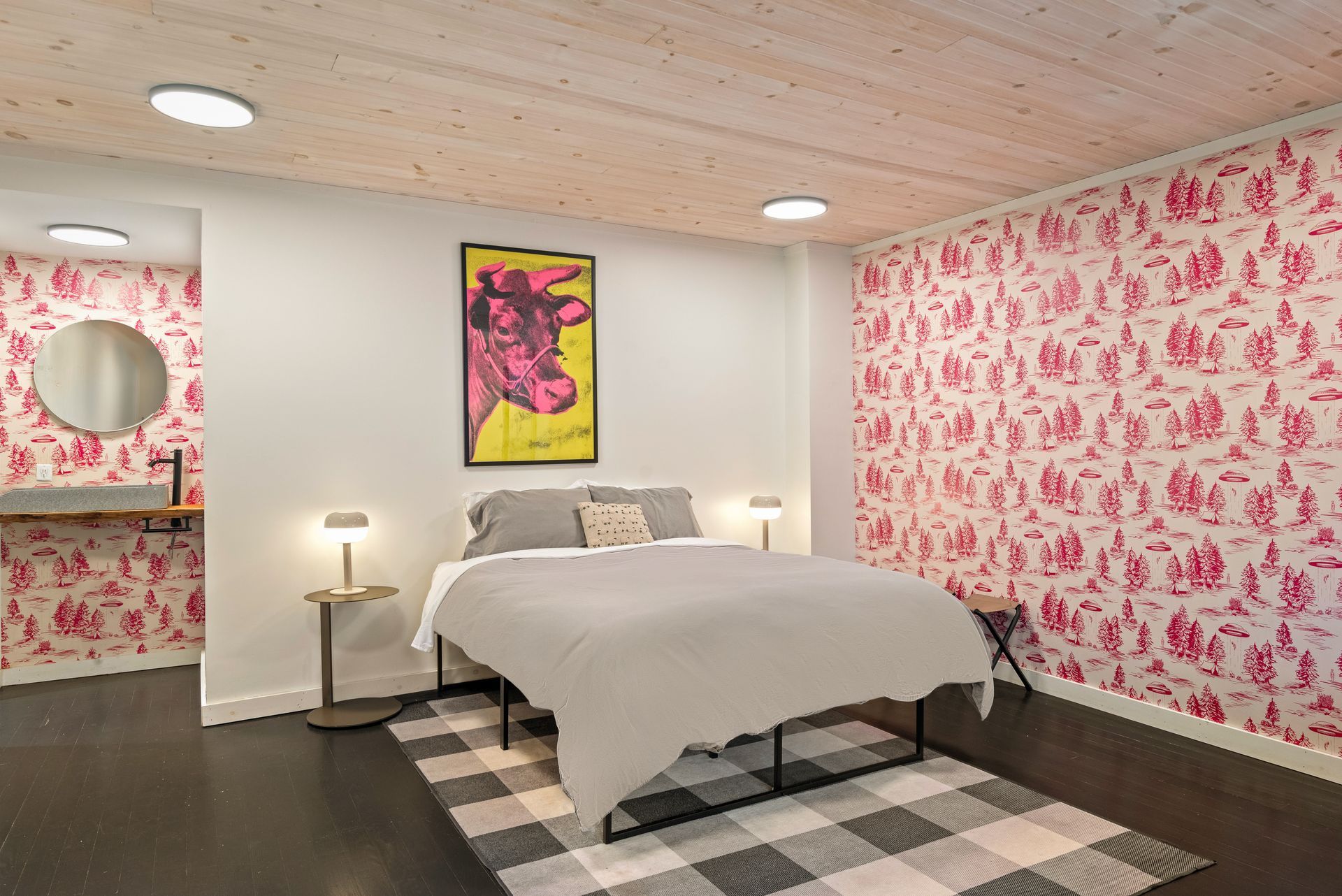 Cozy bedroom for Cabin 227 in Belleayre Lodge in Pine Hill, NY. Comfortable queen bed and wall decor