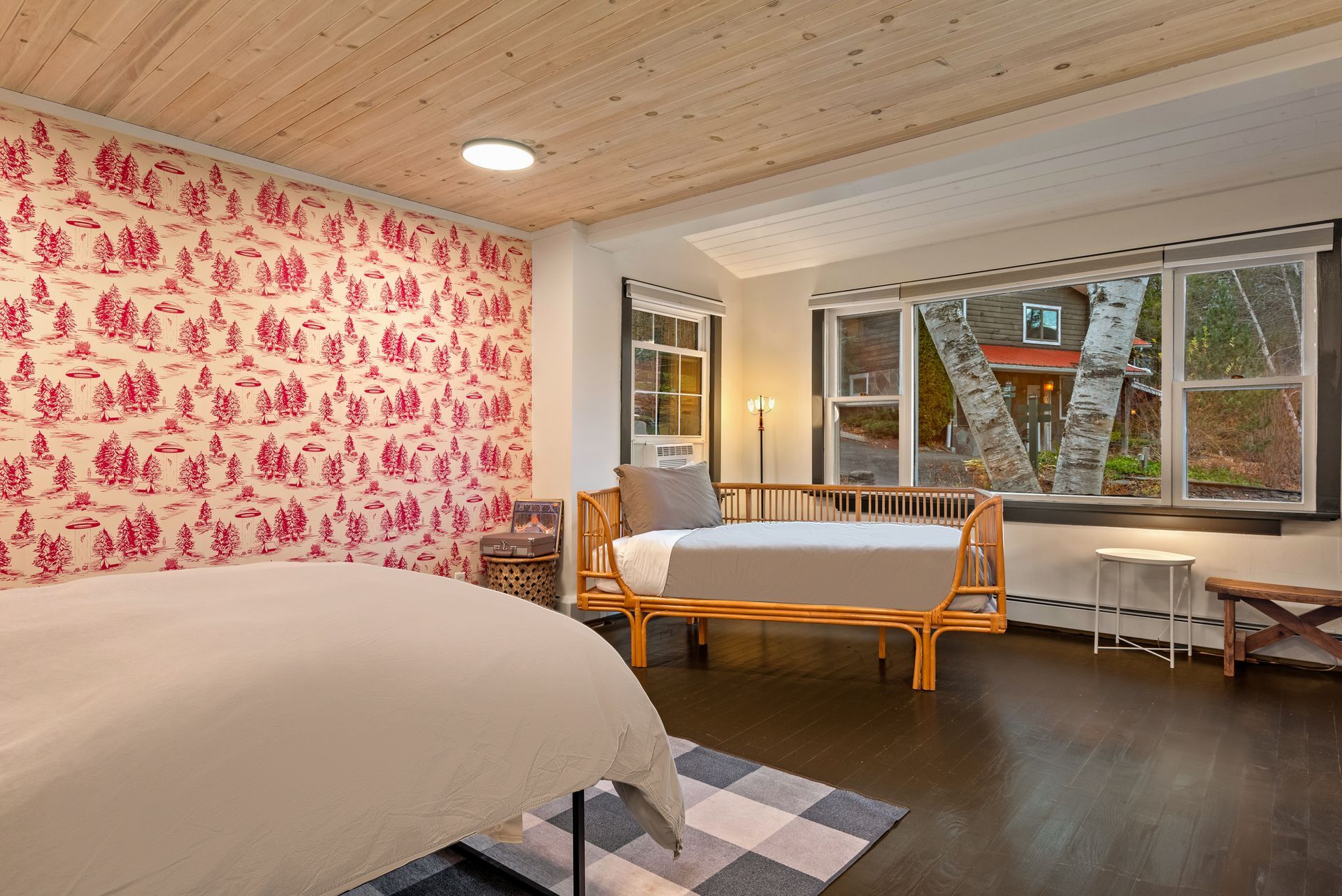 Cozy bedroom for Cabin 227 in Belleayre Lodge in Pine Hill, NY. Comfortable queen bed and wall decor