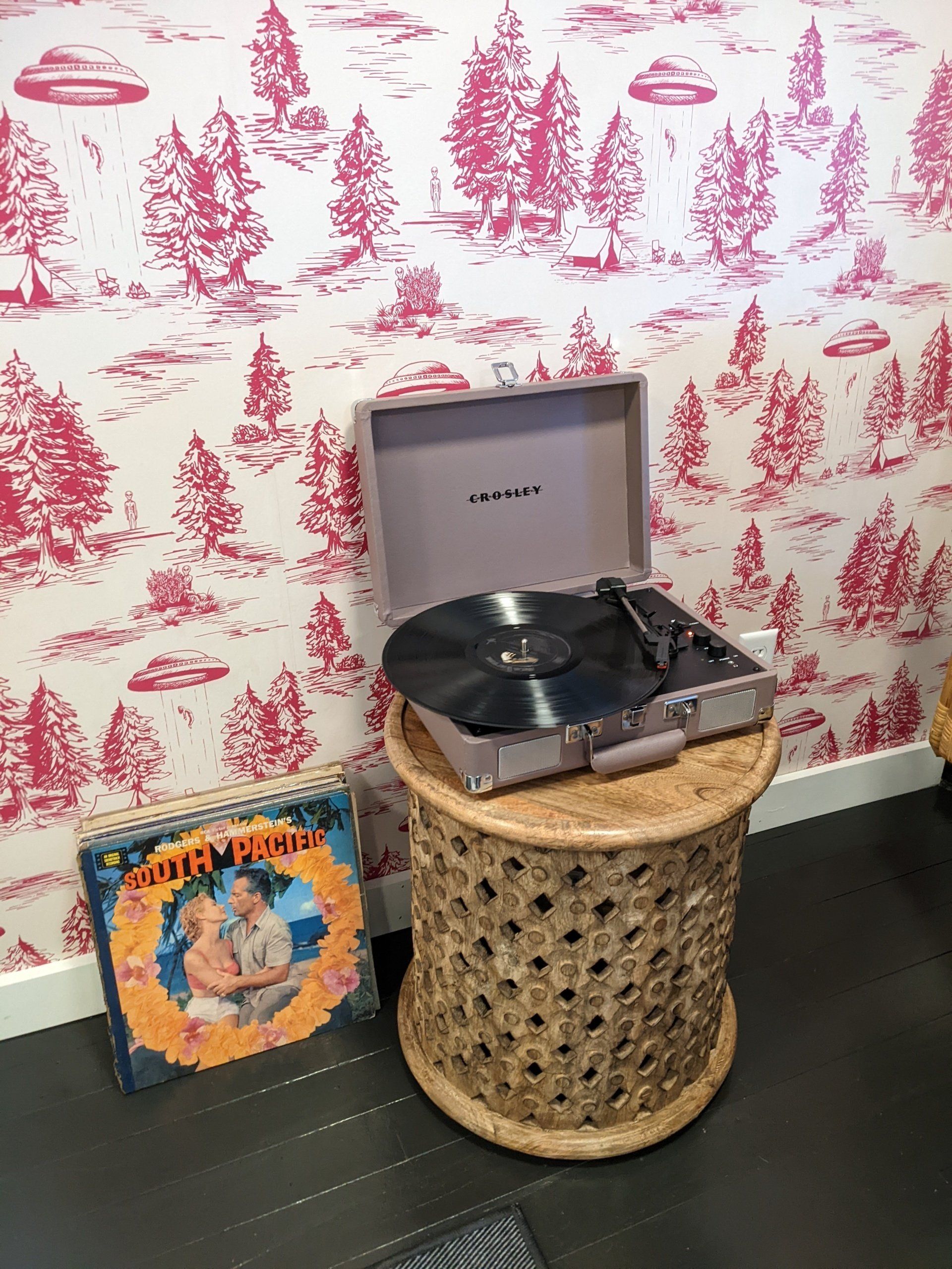 Closeup of one of Belleayre Lodge's cabin amenities: Crosley vintage-style turntable with a vinyl record inside.