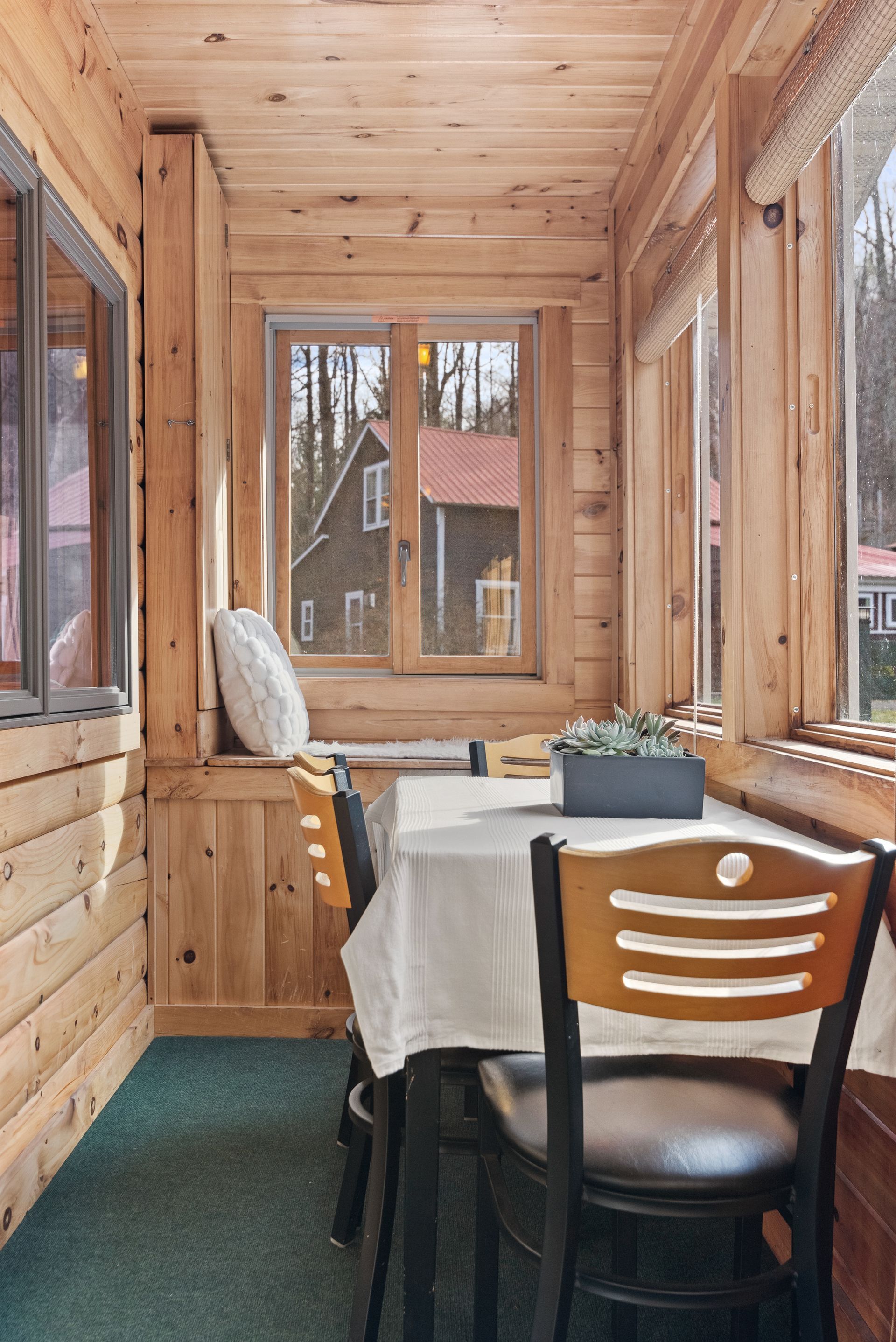Cozy bedroom for Cabin 4A in Belleayre Lodge in Pine Hill, NY - showing beautiful views of the Catksills out the windows