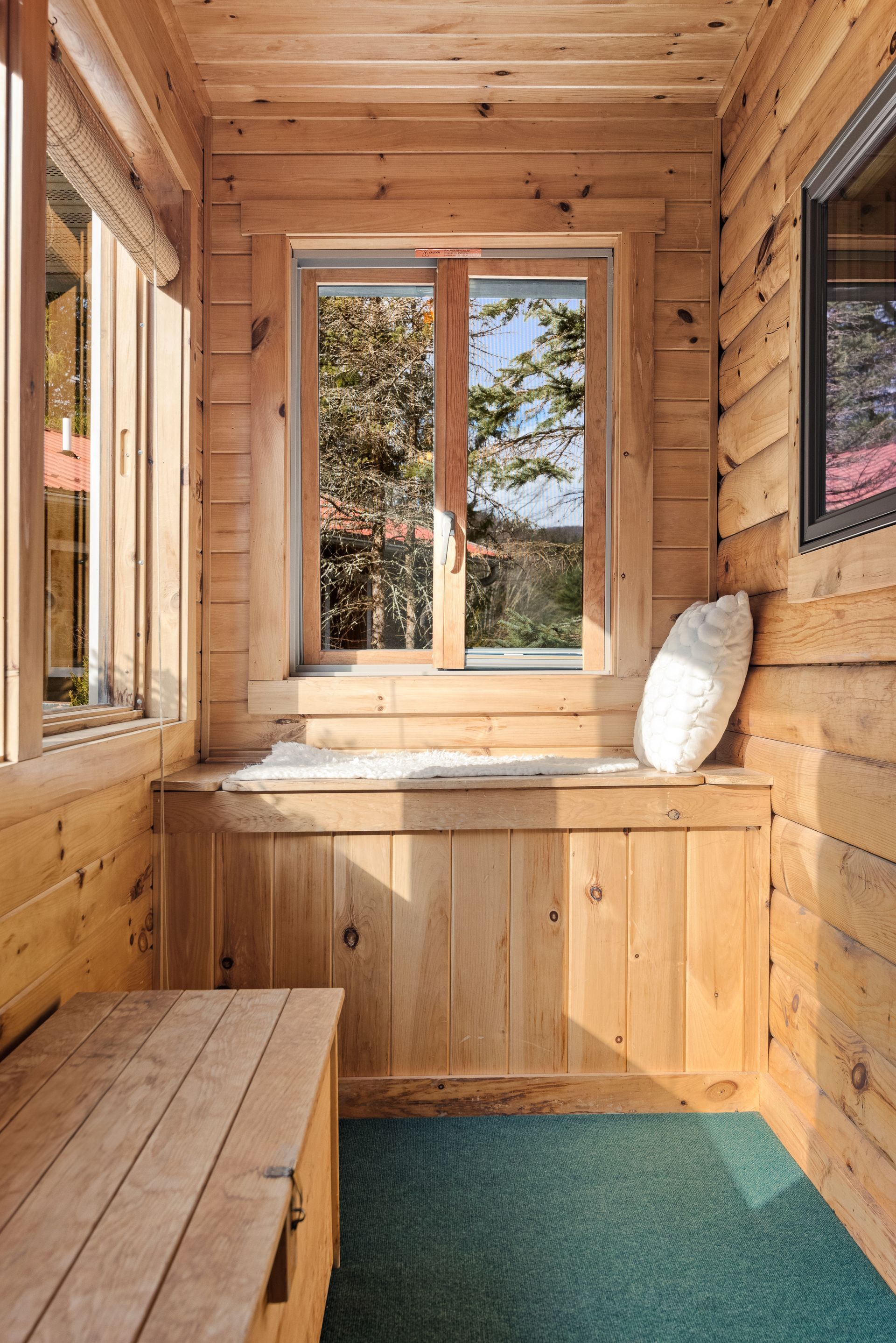 Cozy bedroom for Cabin 4A in Belleayre Lodge in Pine Hill, NY - showing beautiful views of the Catksills out the windows