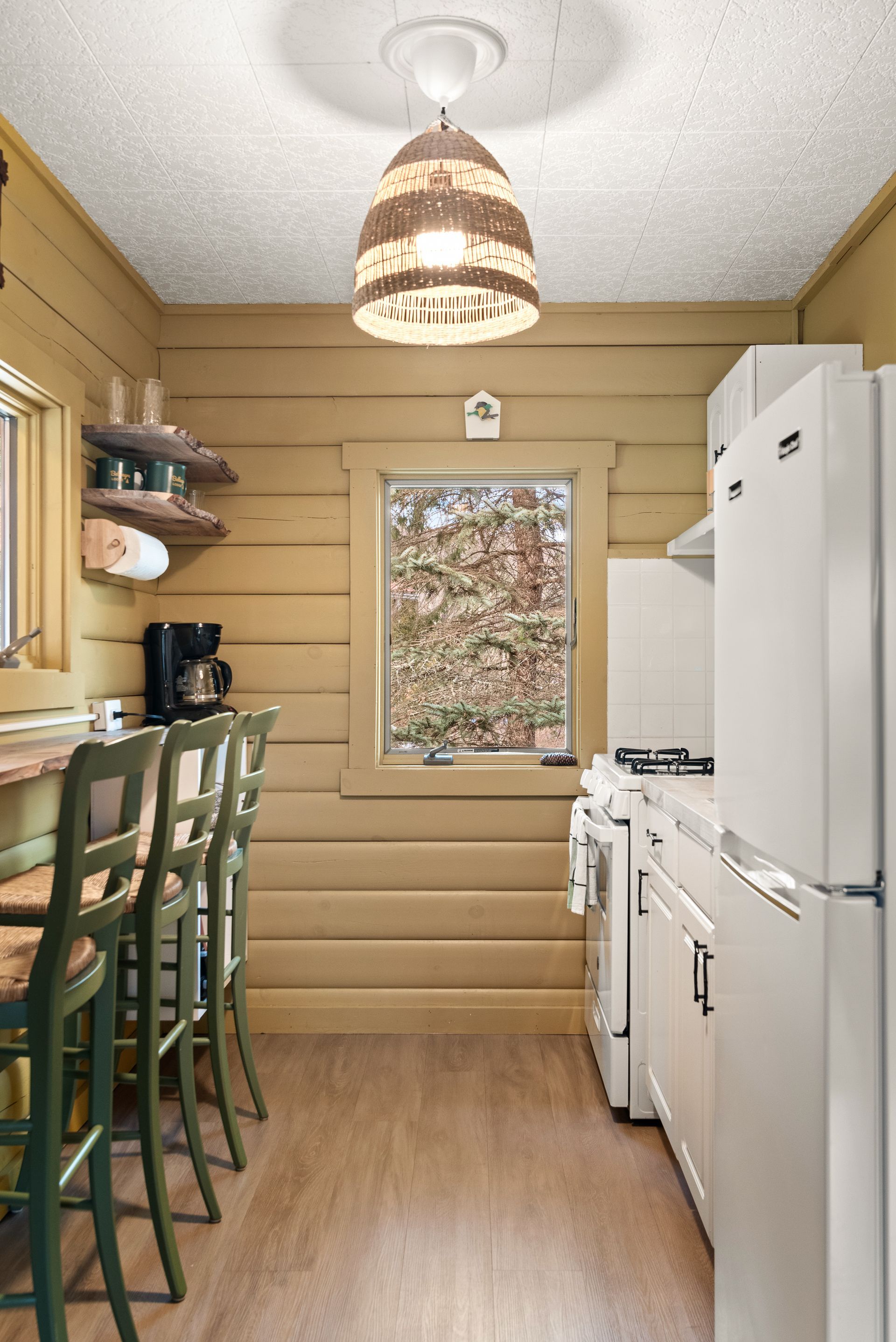 Cozy kitchen for Cabin 4A in Belleayre Lodge in Pine Hill, NY - showing barstools and refrigerators
