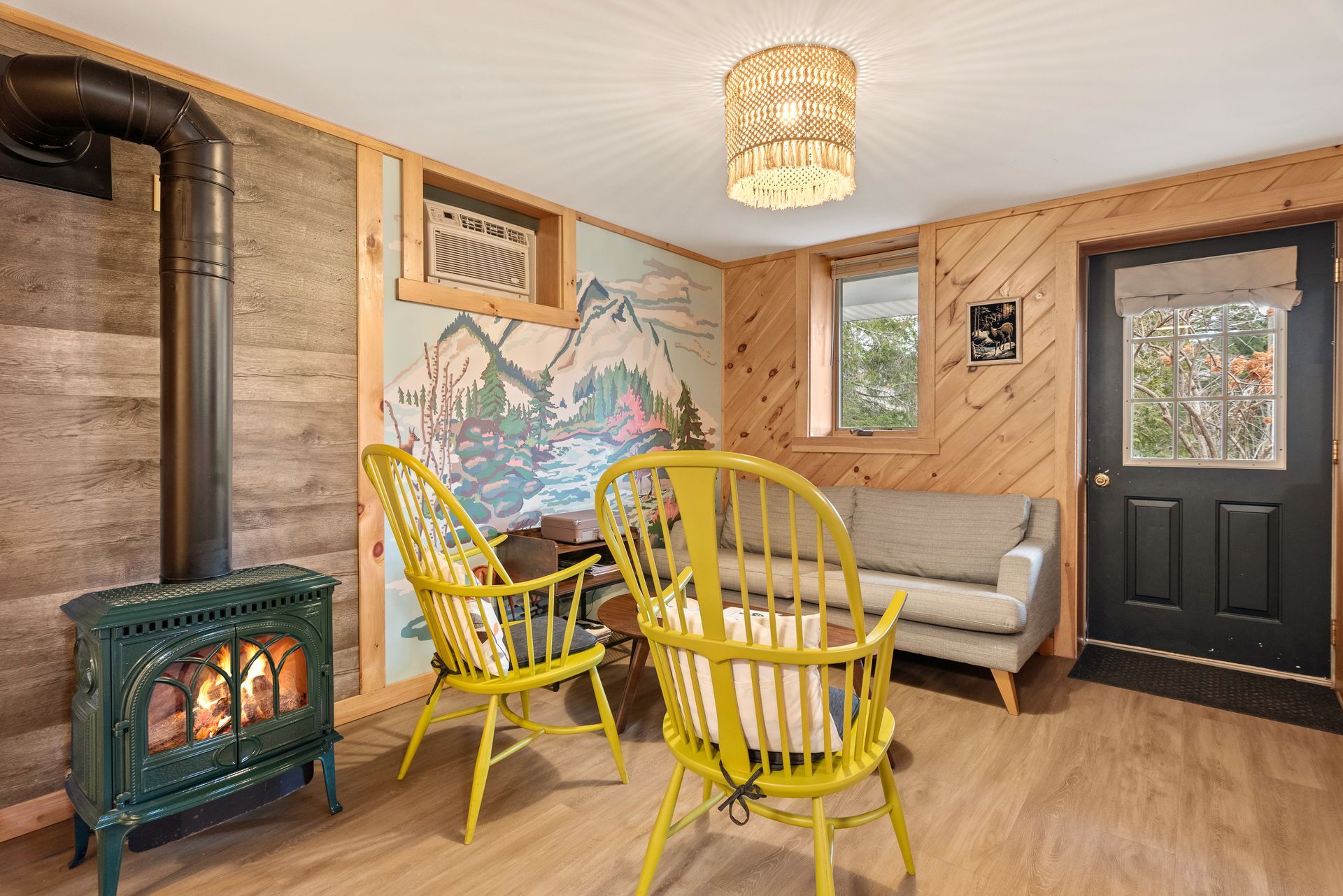 Cozy living space for Cabin 5B in Belleayre Lodge in Pine Hill, NY. Chairs, sofas, and gas fireplace.