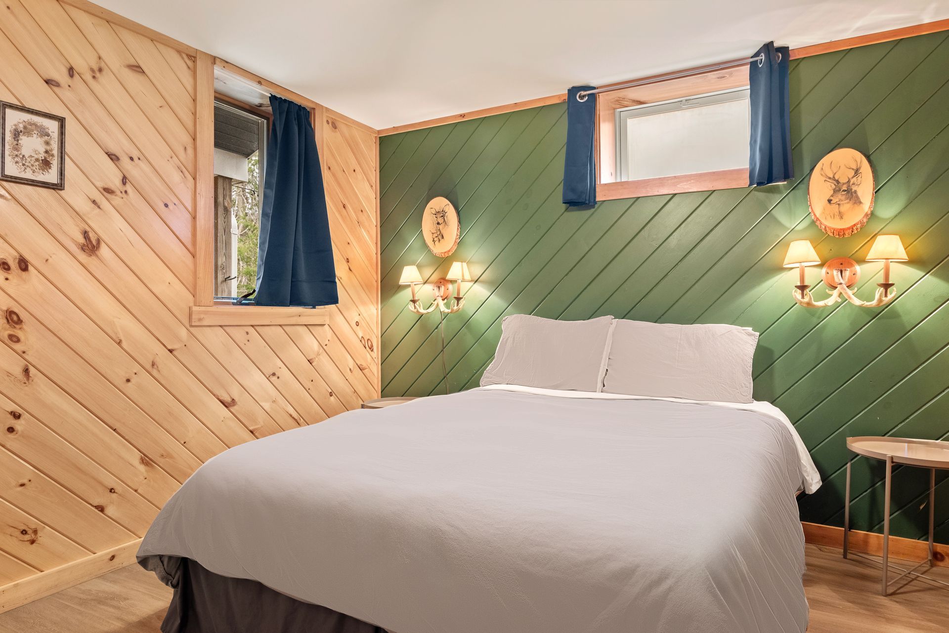 Cozy bedroom for Cabin 5B in Belleayre Lodge in Pine Hill, NY, featuring comfortable bed and beautiful lamps.