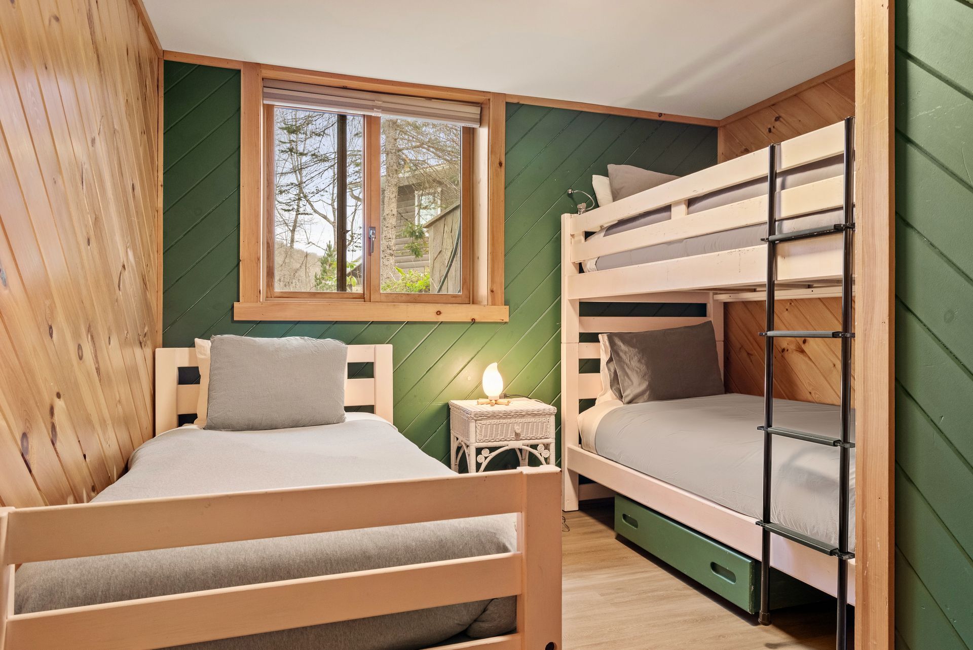 Cozy bedroom for Cabin 5B in Belleayre Lodge in Pine Hill, NY, featuring comfortable twin bed and bunk beds.
