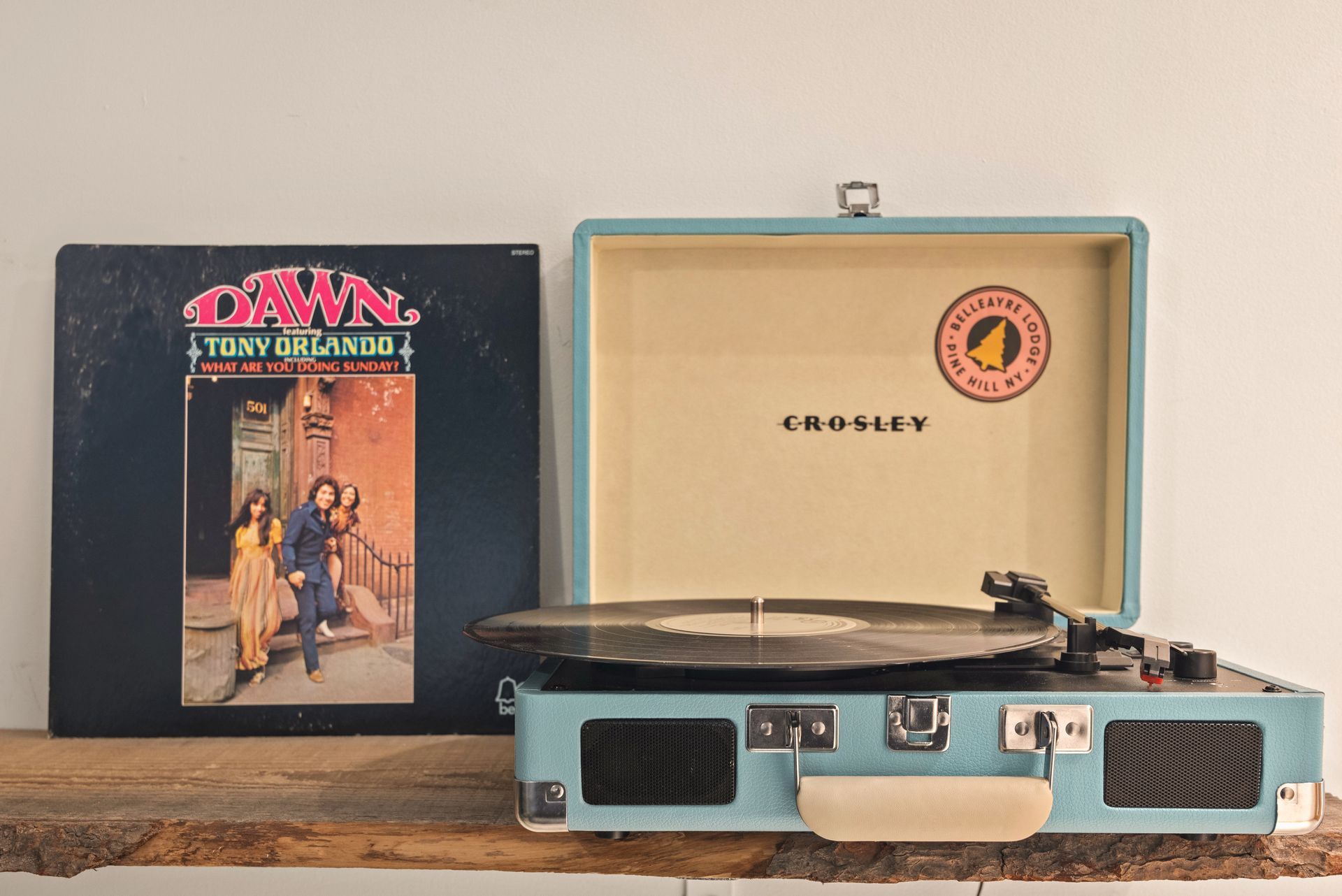 Cozy bedroom for Cabin 8 in Belleayre Lodge in Pine Hill, NY. Closeup of Crossley turntable with vinyl LP's