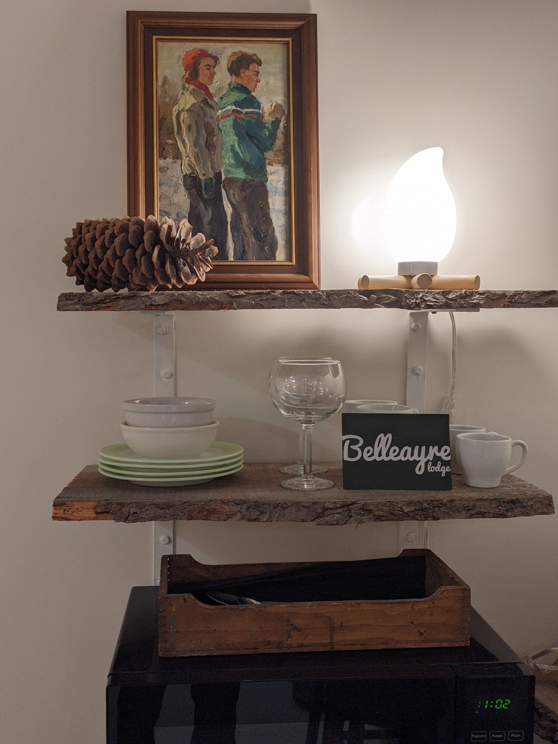 Closeup of shelf with Belleayre Lodge-branded tabletop. Part of Cabin #8.