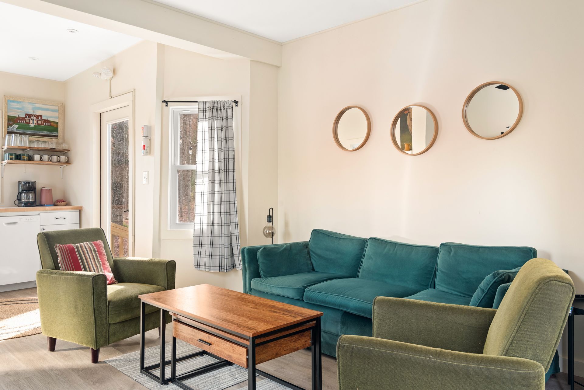 Cozy living room for Cabin 9 in Belleayre Lodge in Pine Hill, NY. Comfortable furniture and wall decor