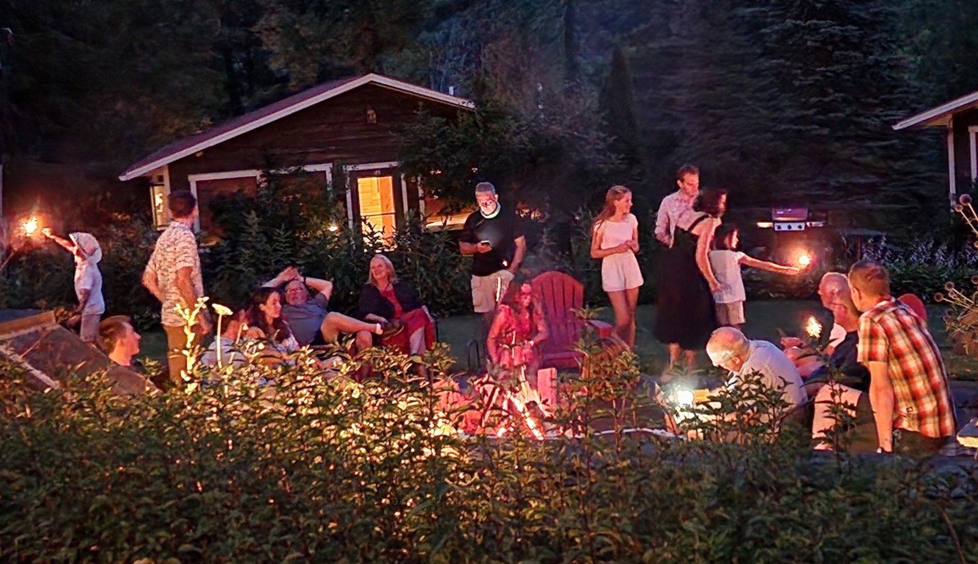 People gathering outdoors at nighttime for an event at Belleayre Lodge in Catskills, New York.