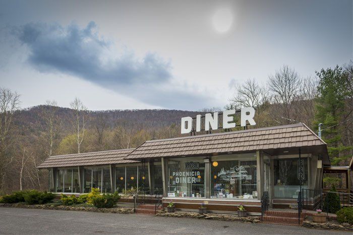 Outdoor image of Phoenicia Diner, with scenic Catskills views in background. Close to Belleayre Lodge.