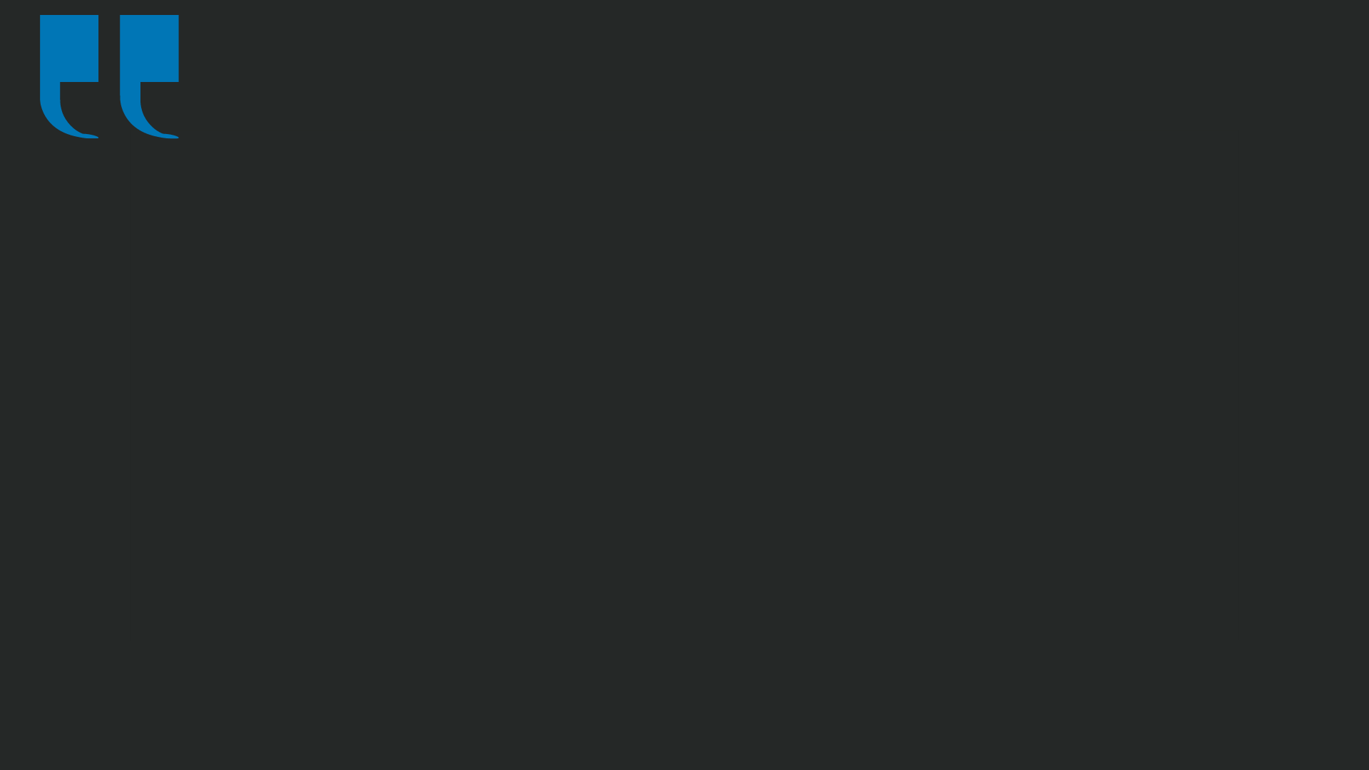 Blue quotation marks on a dark gray background.
