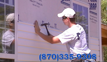 Two people buffing a car's chrome trim with electric polishers.