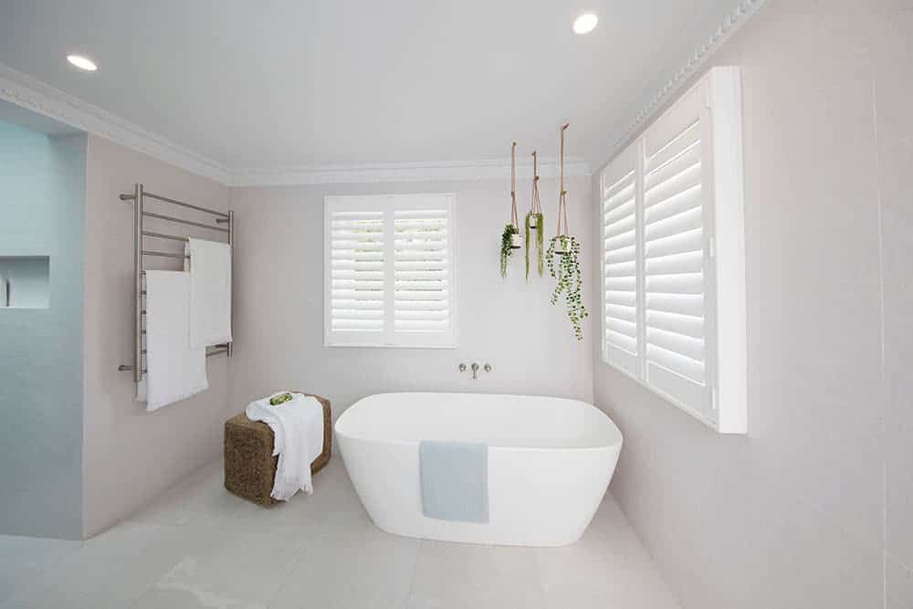A White Shutter In Bathroom — Blinds in Bogangar, NSW