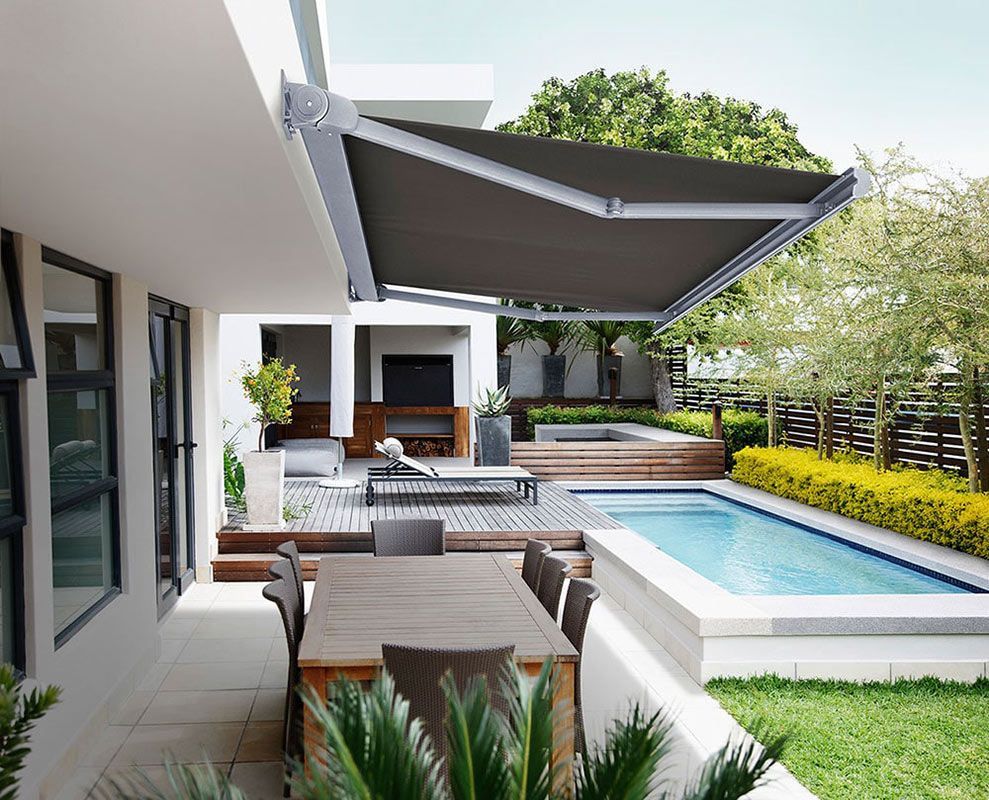 A home with outdoor awnings and indoor blinds.