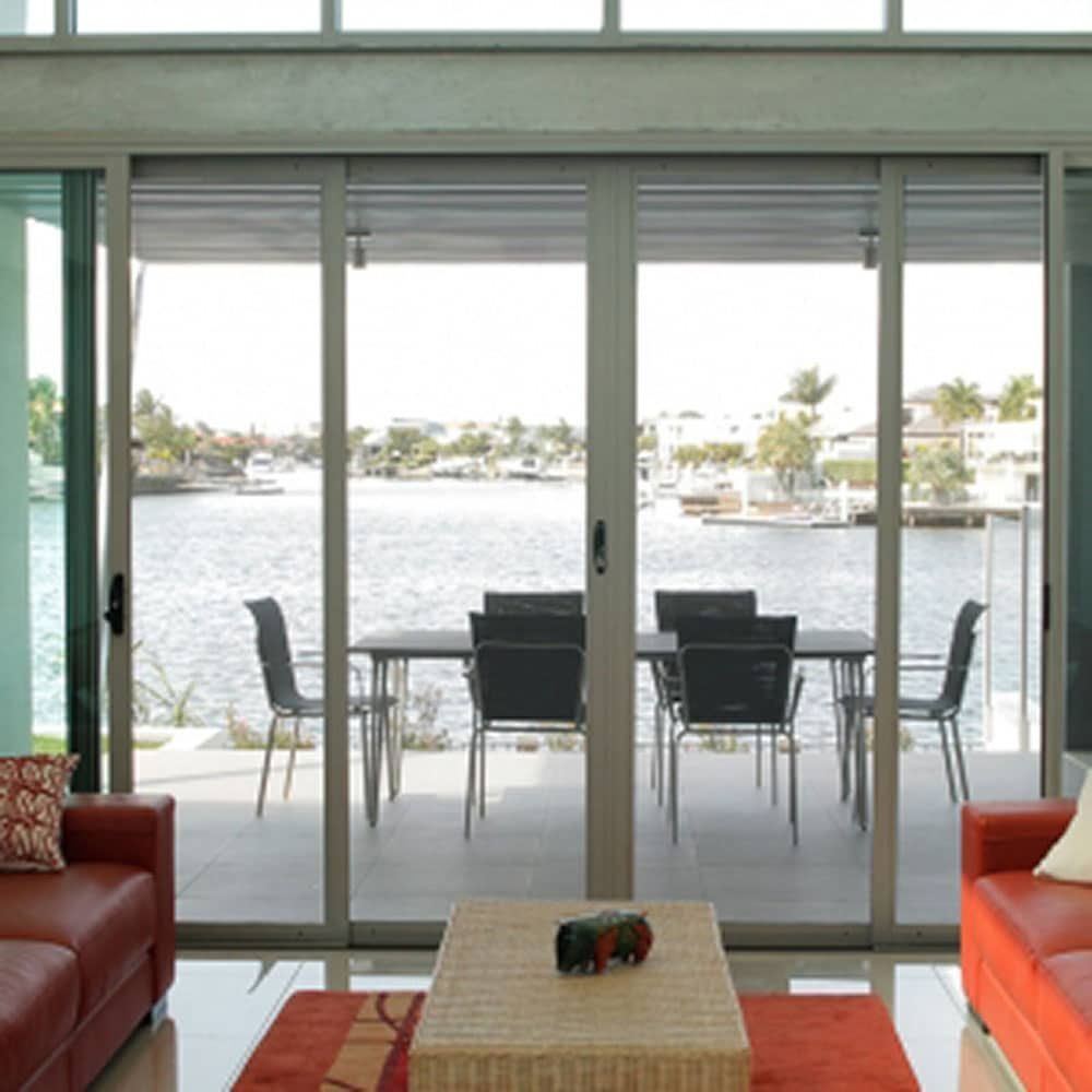 House with Lake View Seen through Window — Blinds in Bogangar, NSW