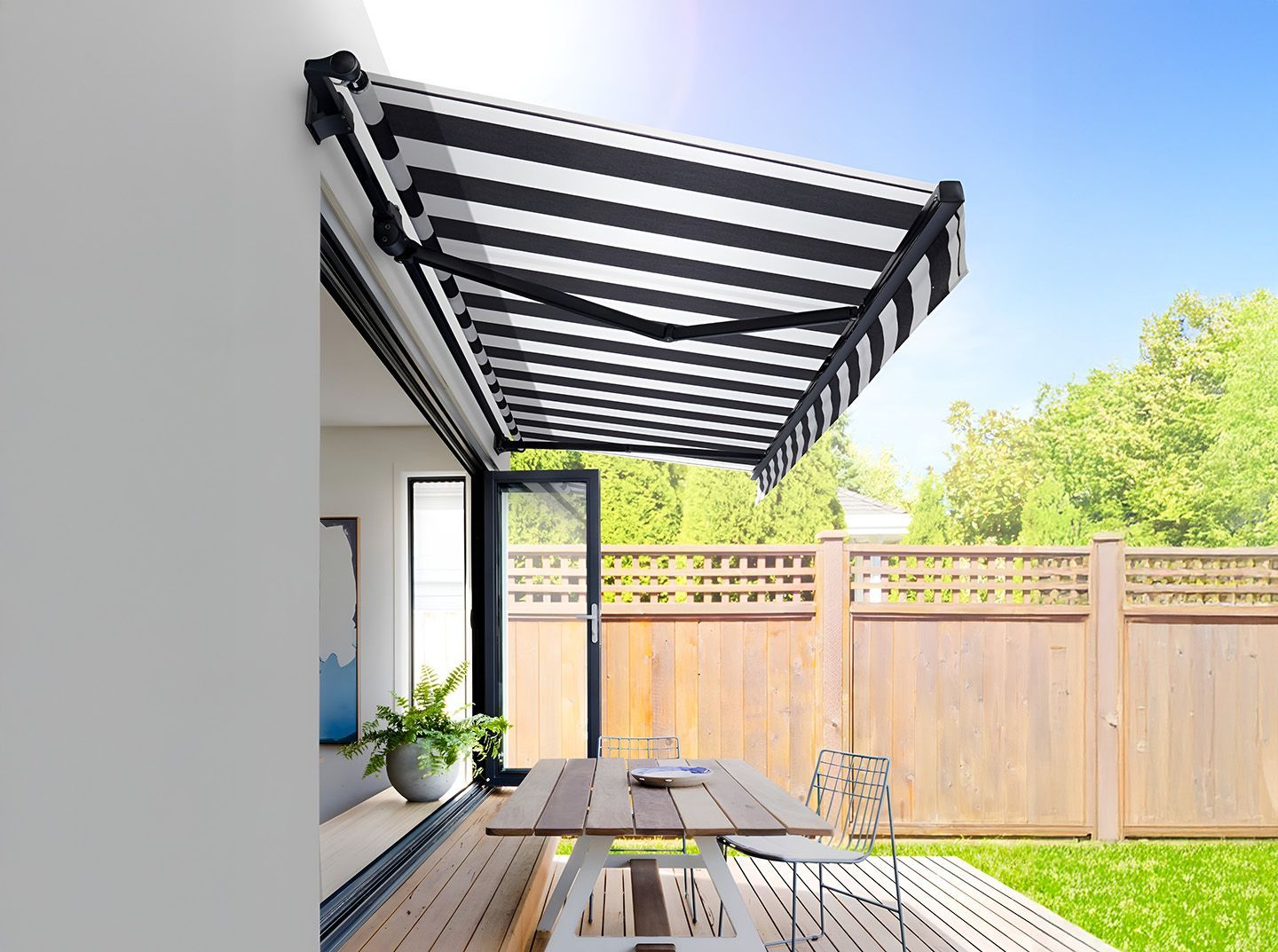 Striped Awnings In Tweed Heads Shading An Outdoor Restaurant Dining Table