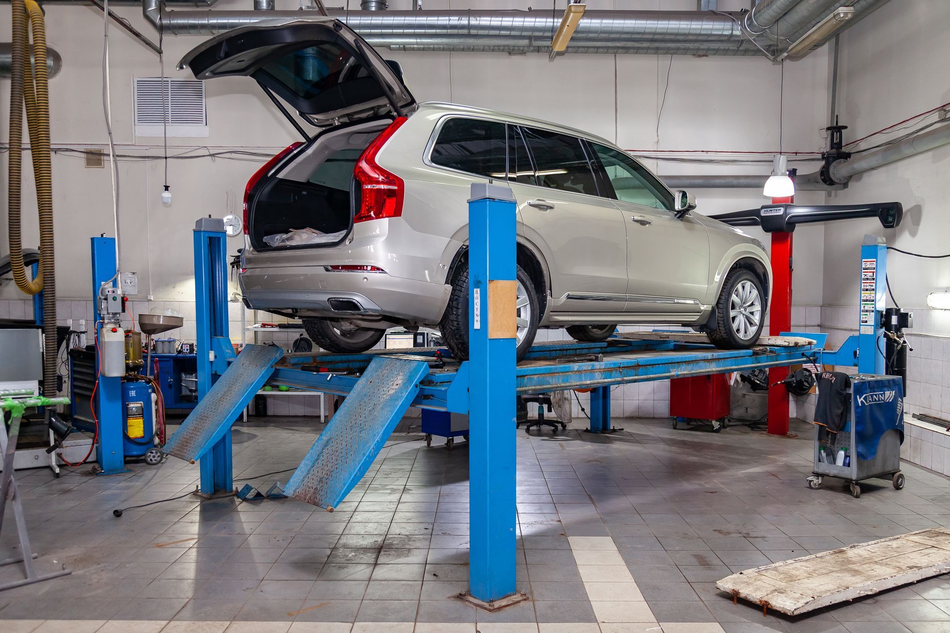 A Car is Sitting on a Lift in a Garage