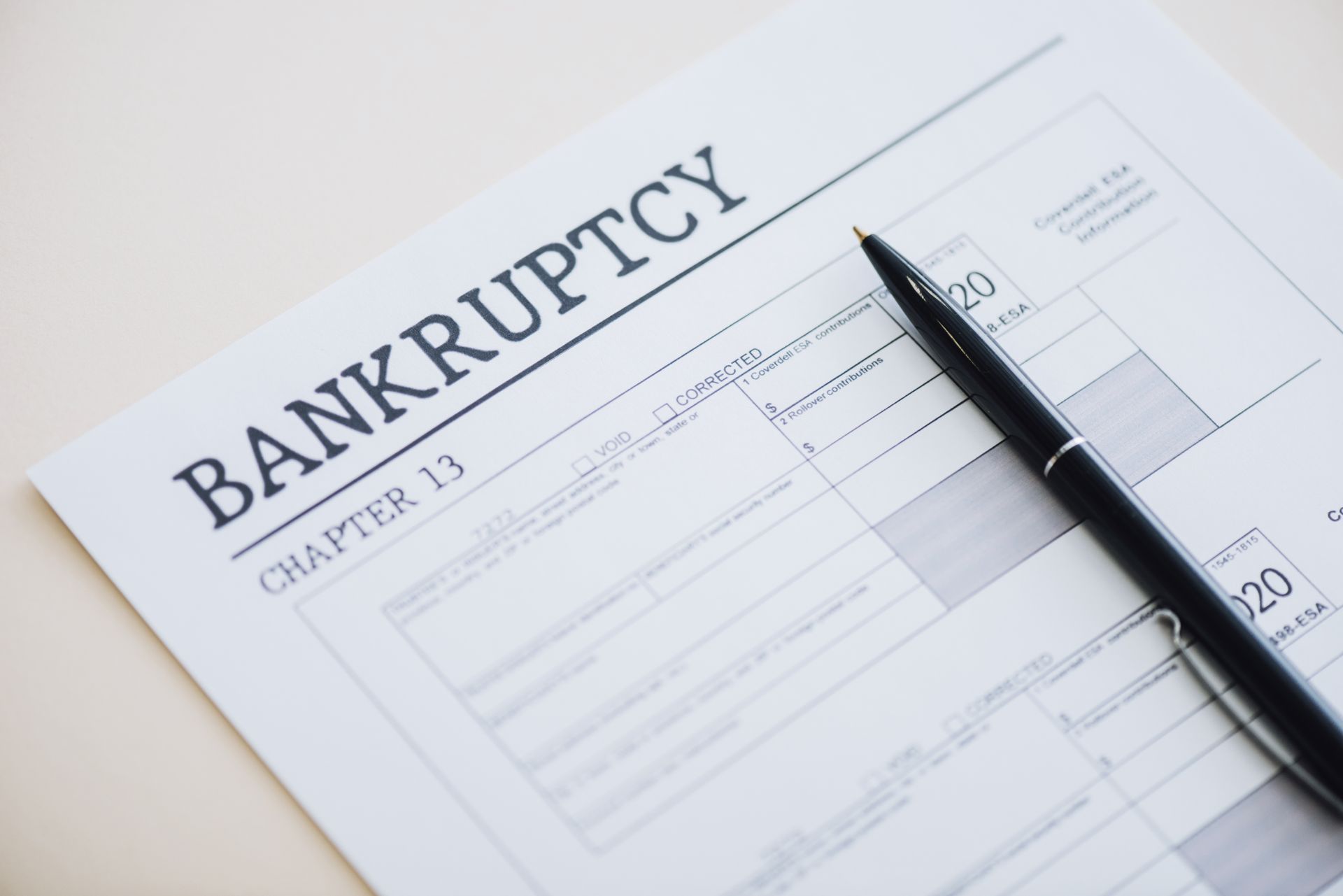Chapter 13 bankruptcy form document with pen, close-up view for legal filing concept.