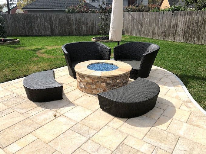 Custom fire pit in home backyard