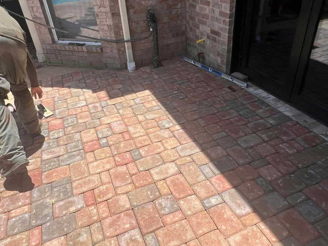 Detail of a paver patio construction process