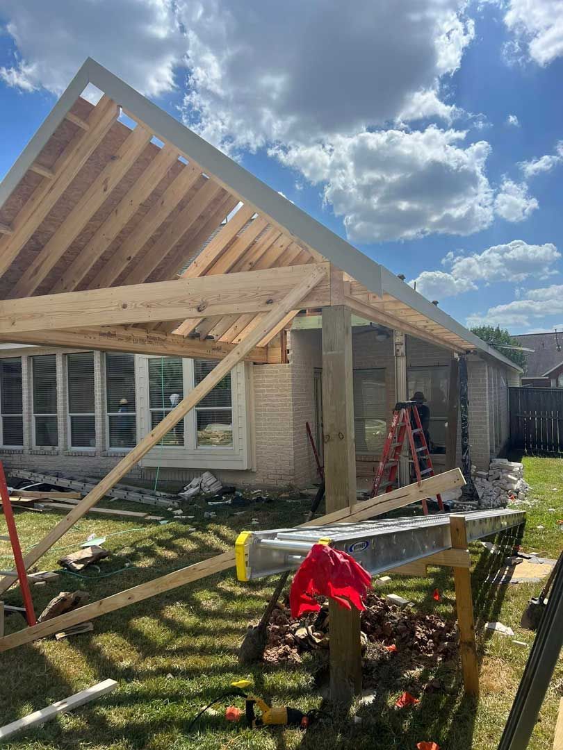 Wooden patio cover construction in the backyard