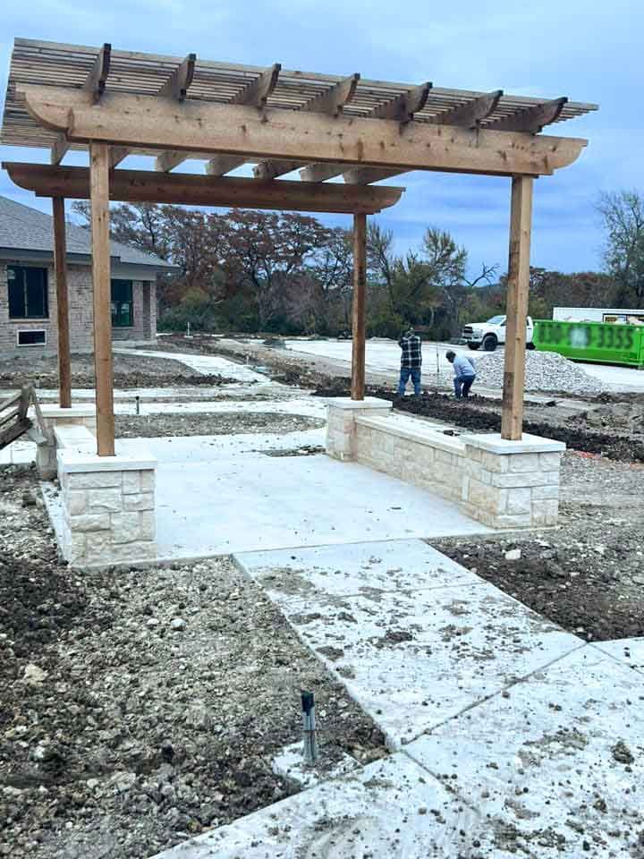 Installation of a wooden pergola on a new cement patio