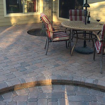 residential paver patio with steps and furniture