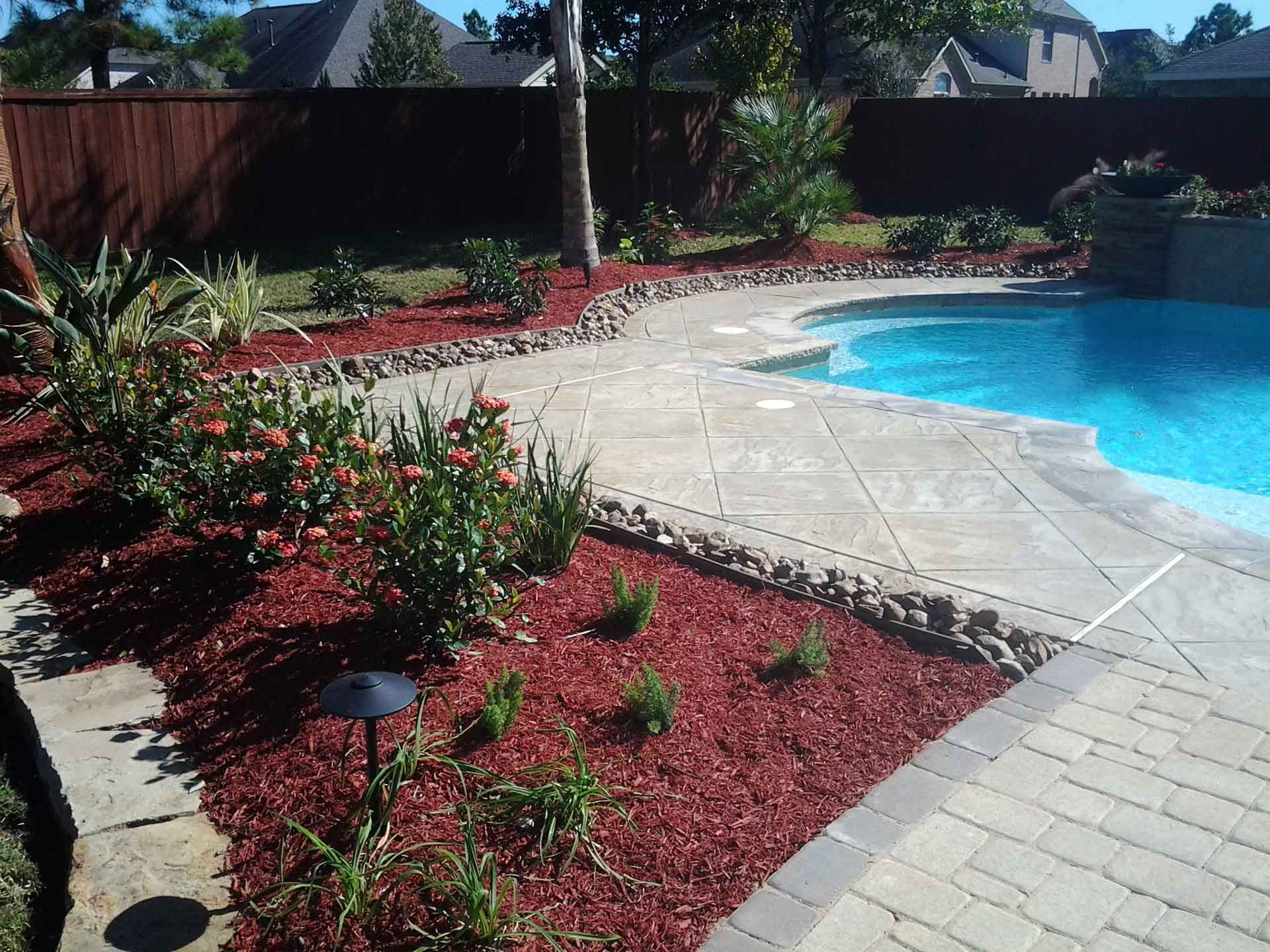 Marble tile pool area and landscaping bed decorations