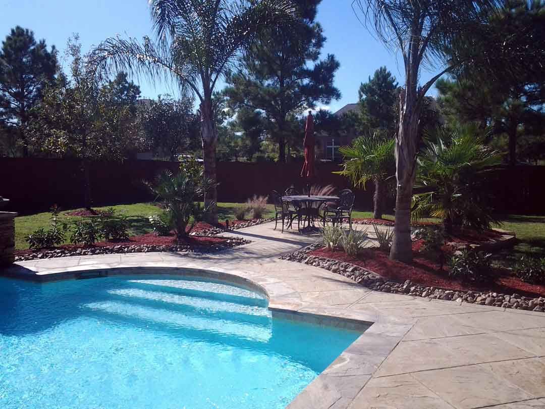 Marble tile pool area and landscaping bed decorations