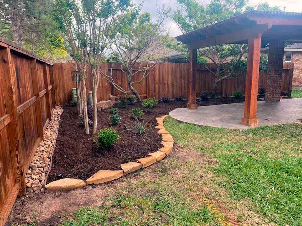 Outdoor space with pergola and landscaping