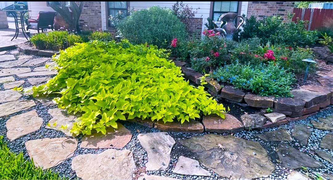 Front yard stoned landscaping with pathway