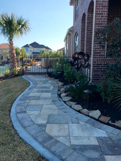 Pavers walkway with beautiful landscaping