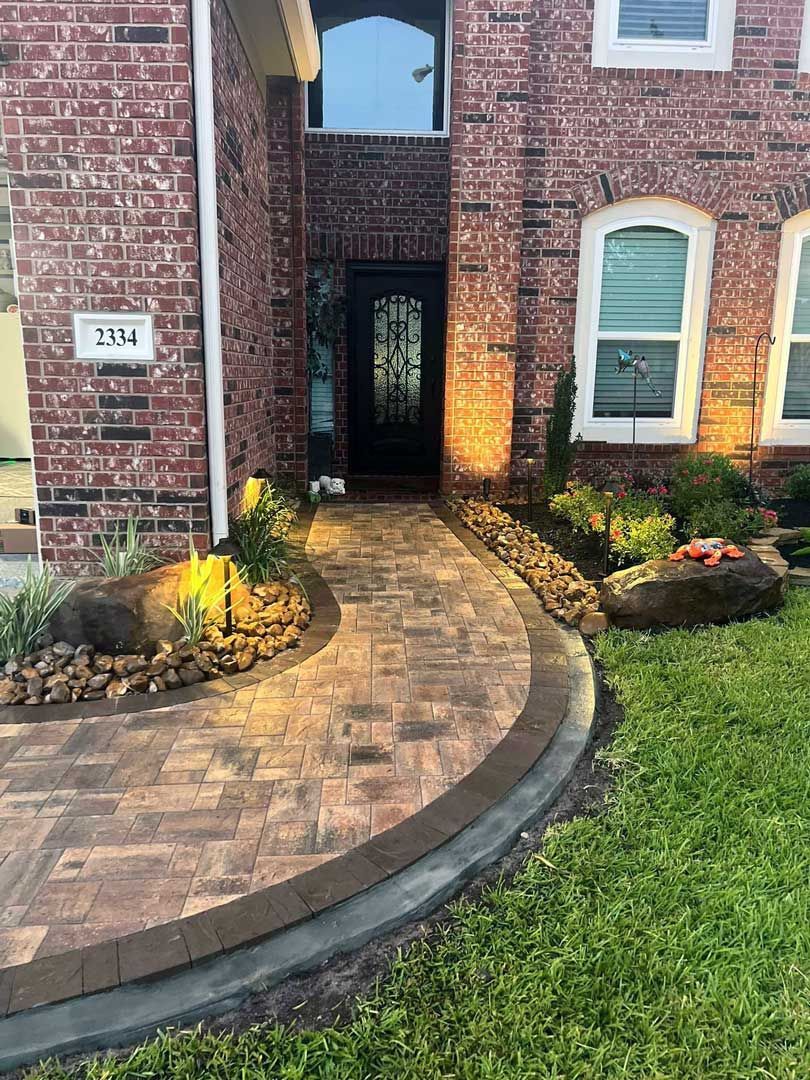 Stone curved pathway with landscaping bed