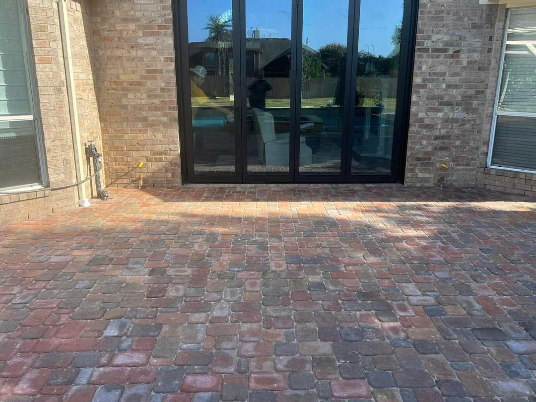 Red-toned brick backyard patio