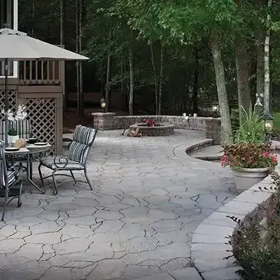 there is a fire pit in the middle of the patio .