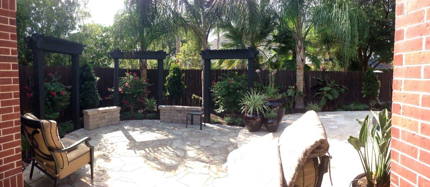A beautiful circular outdoor patio made of stone with Chinese-style pergolas