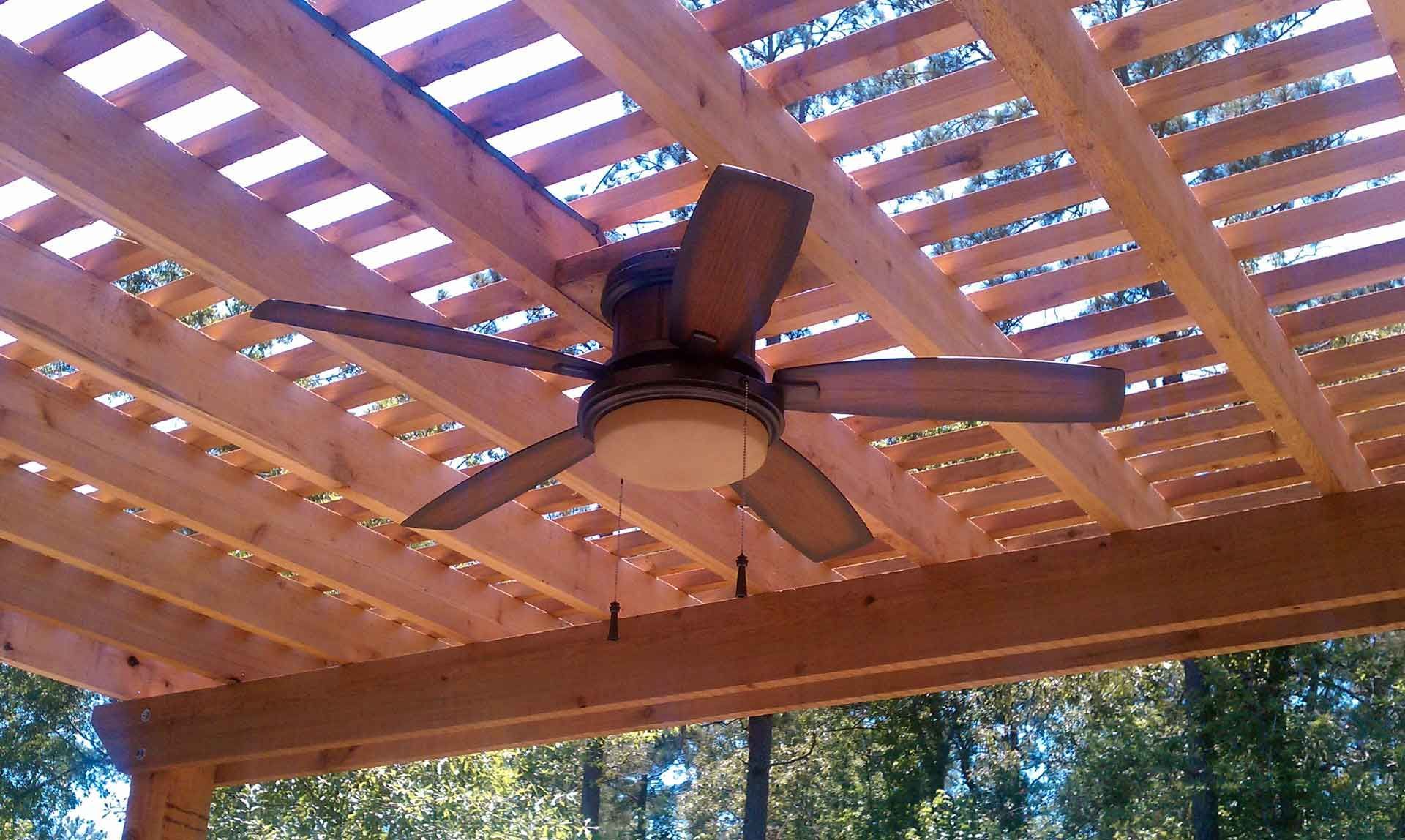 Custom cedar attached pergola with blade fan