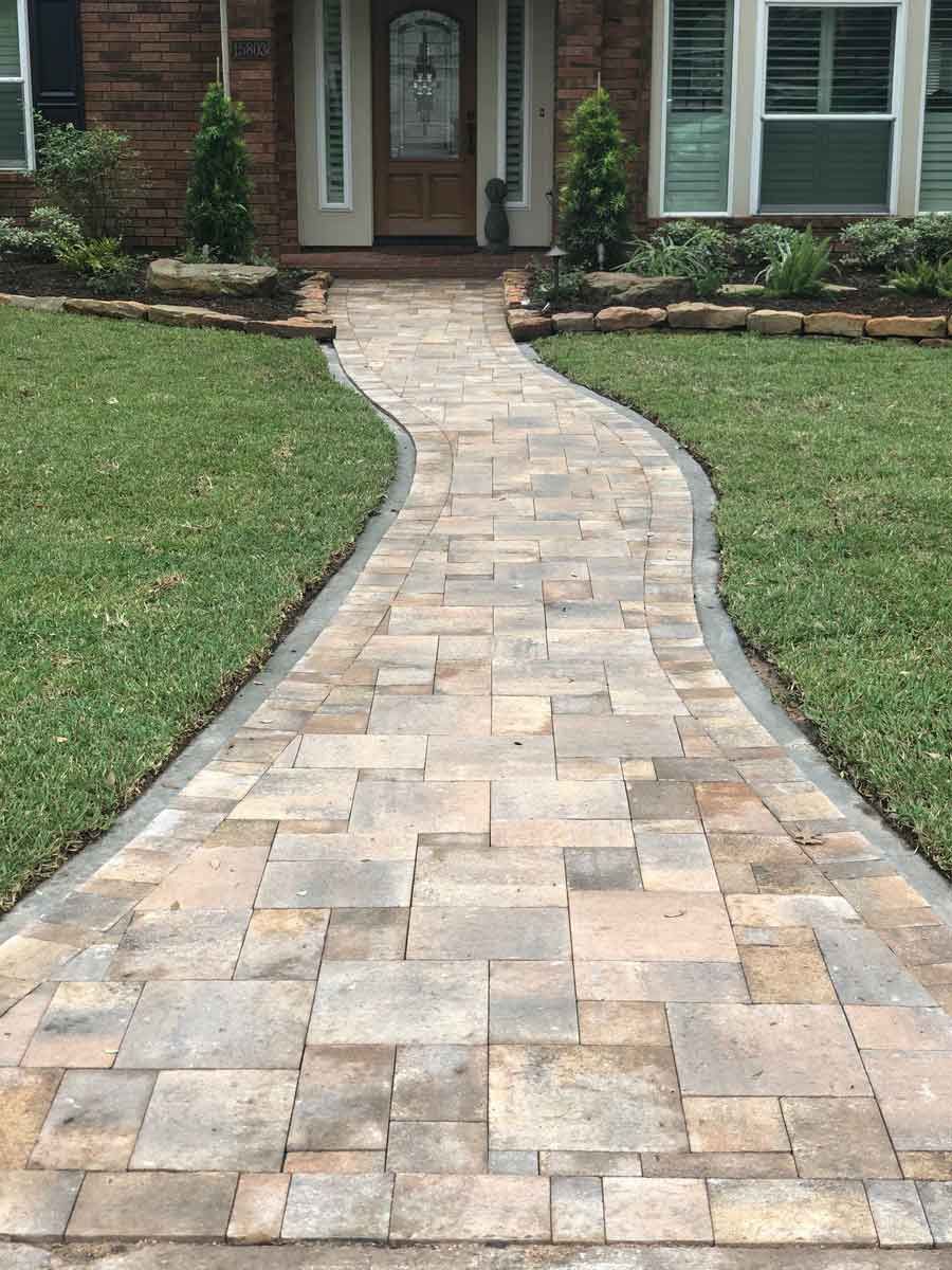 Long pathway in square pavers limestone for entrance