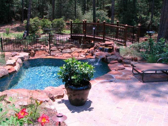 Nice pond with stone waterfall and red brick courtyard
