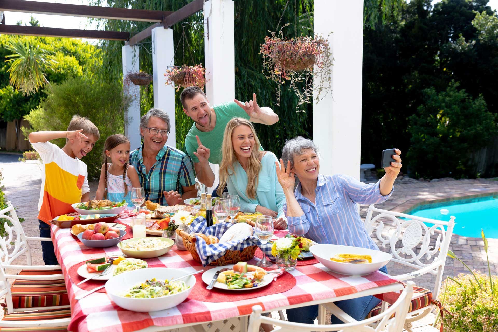 Family enjoying lunch in a Texas backyard during Summer