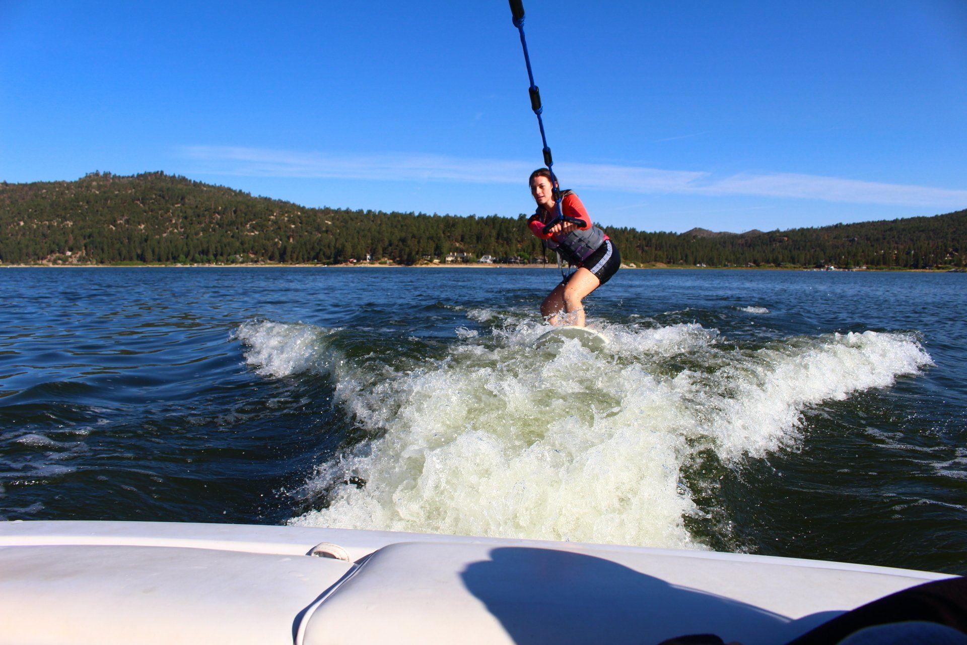 Girl wakeboarding at Big Bear Lake CA