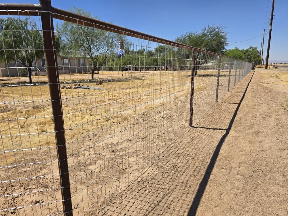 Chris Installing Woven Wire on a Maricopa Farm