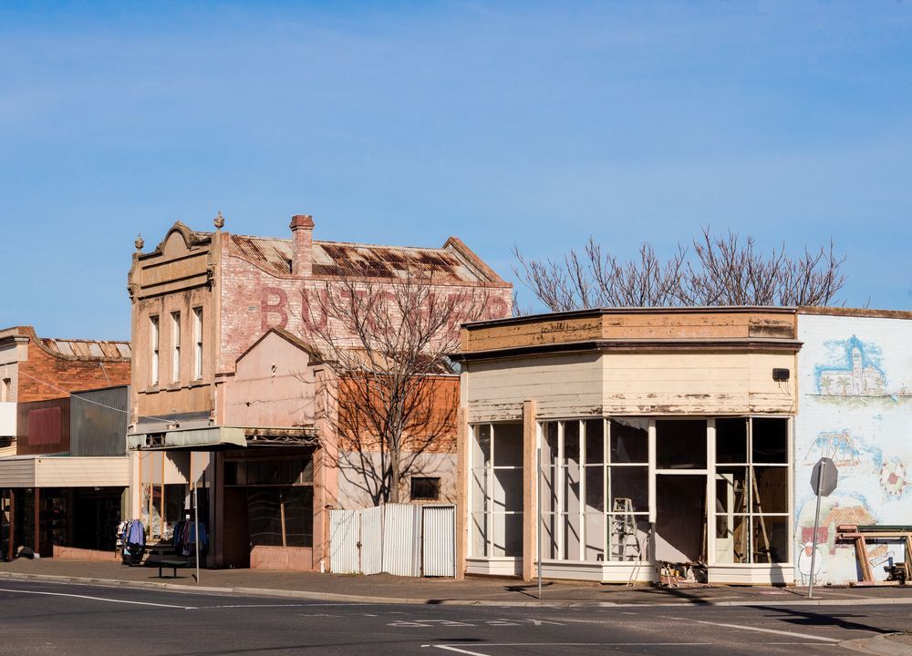 A Row of Old Buildings On The Corner Of A Street โ Stand Fast Electrical Pty Ltd in Inglewood, QLD
