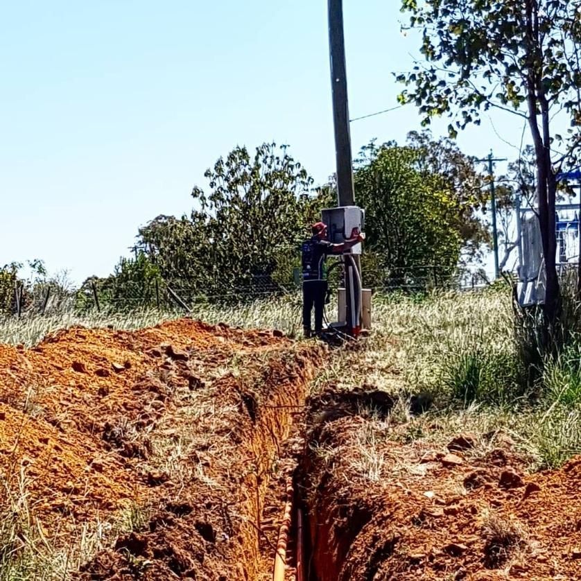 Man Checking The Electrical Pole — Stand Fast Electrical Pty Ltd in Allora, QLD