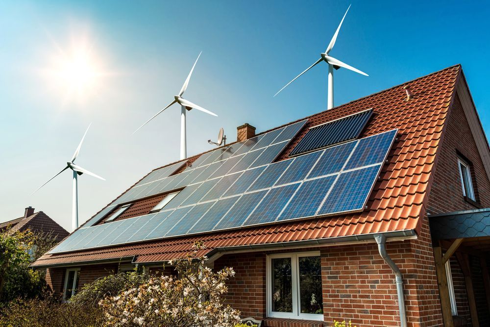 Solar Panels On A Roof  And Wind Turbines On House — Stand Fast Electrical Pty Ltd in Allora, QLD