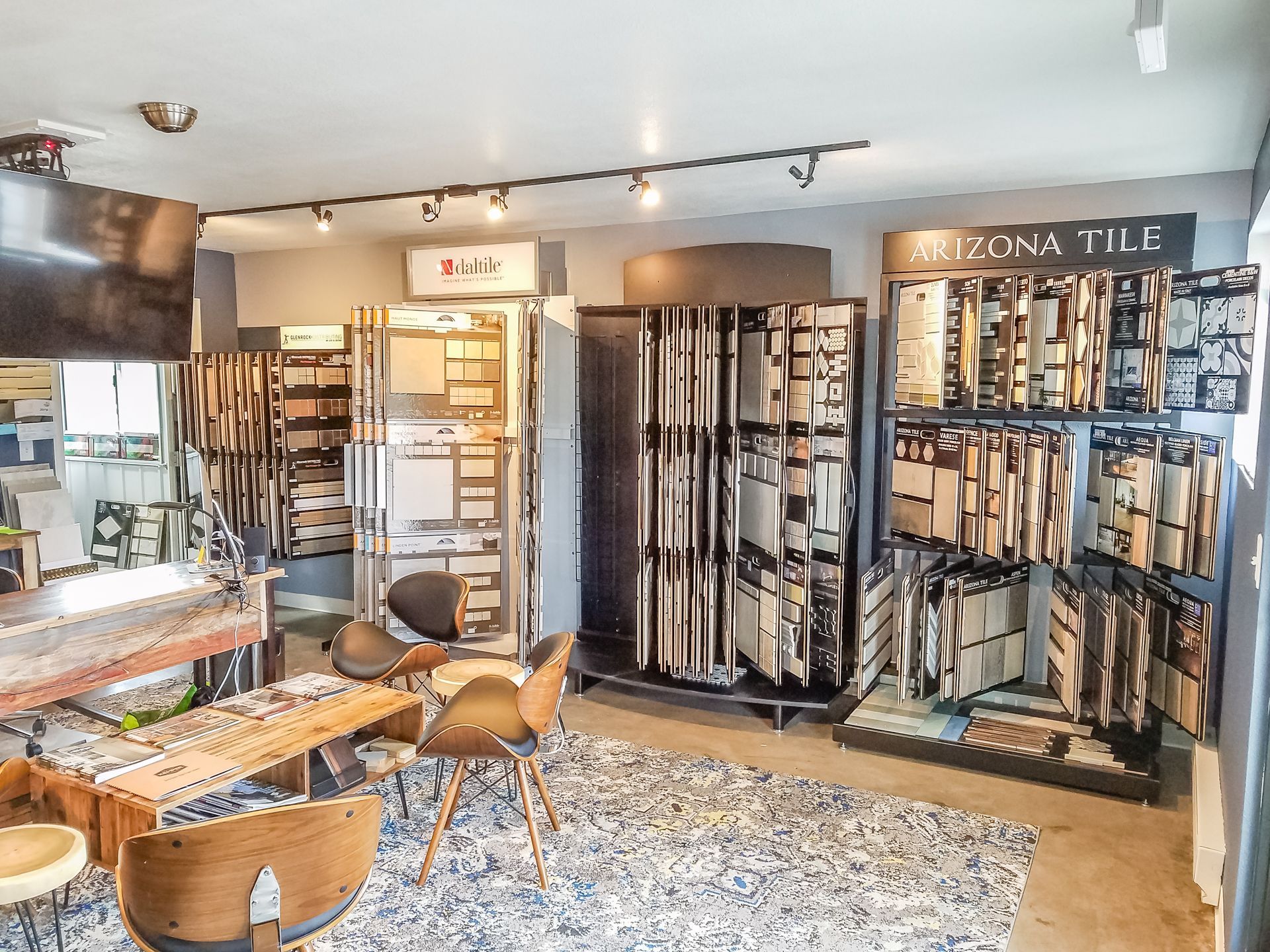 A living room with a table and chairs in a store.