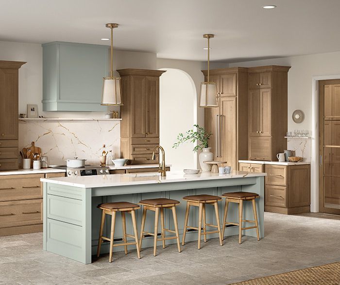 A kitchen with a large island and stools