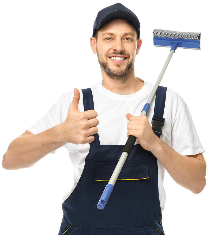 A man in overalls is holding a window cleaner and giving a thumbs up.