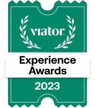 Viator Experience Awards 2023 badge, green and white with a laurel wreath and text.