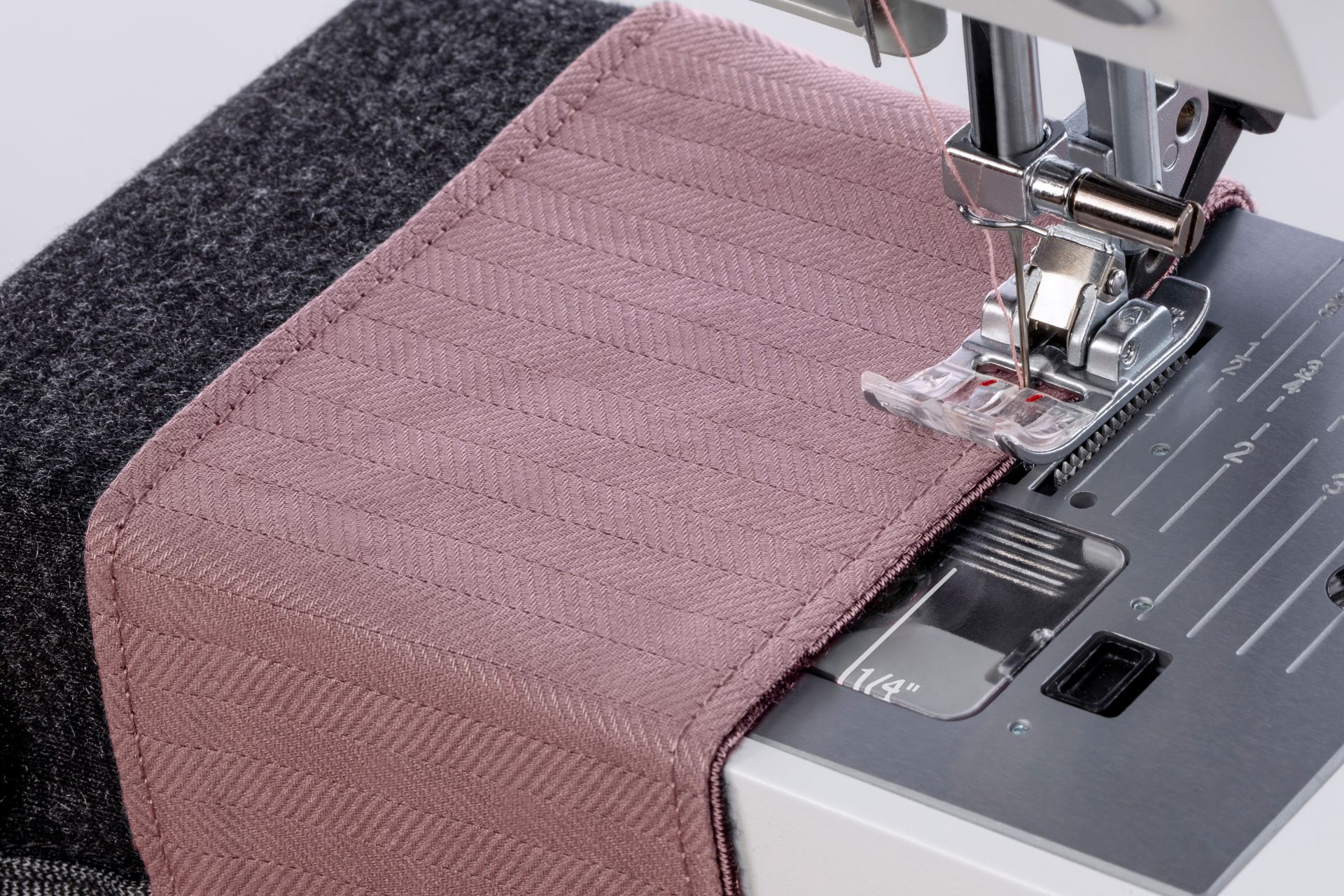 A close up of a sewing machine with a piece of fabric on it.